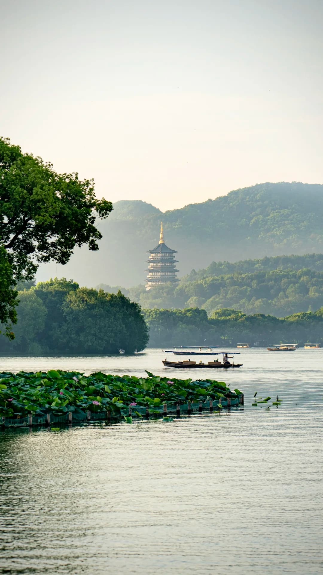 Leifeng Pagoda (雷峰塔) - A reconstructed five-story octagonal pagoda on Sunset Hill overlooking West Lake, famous from the Le...