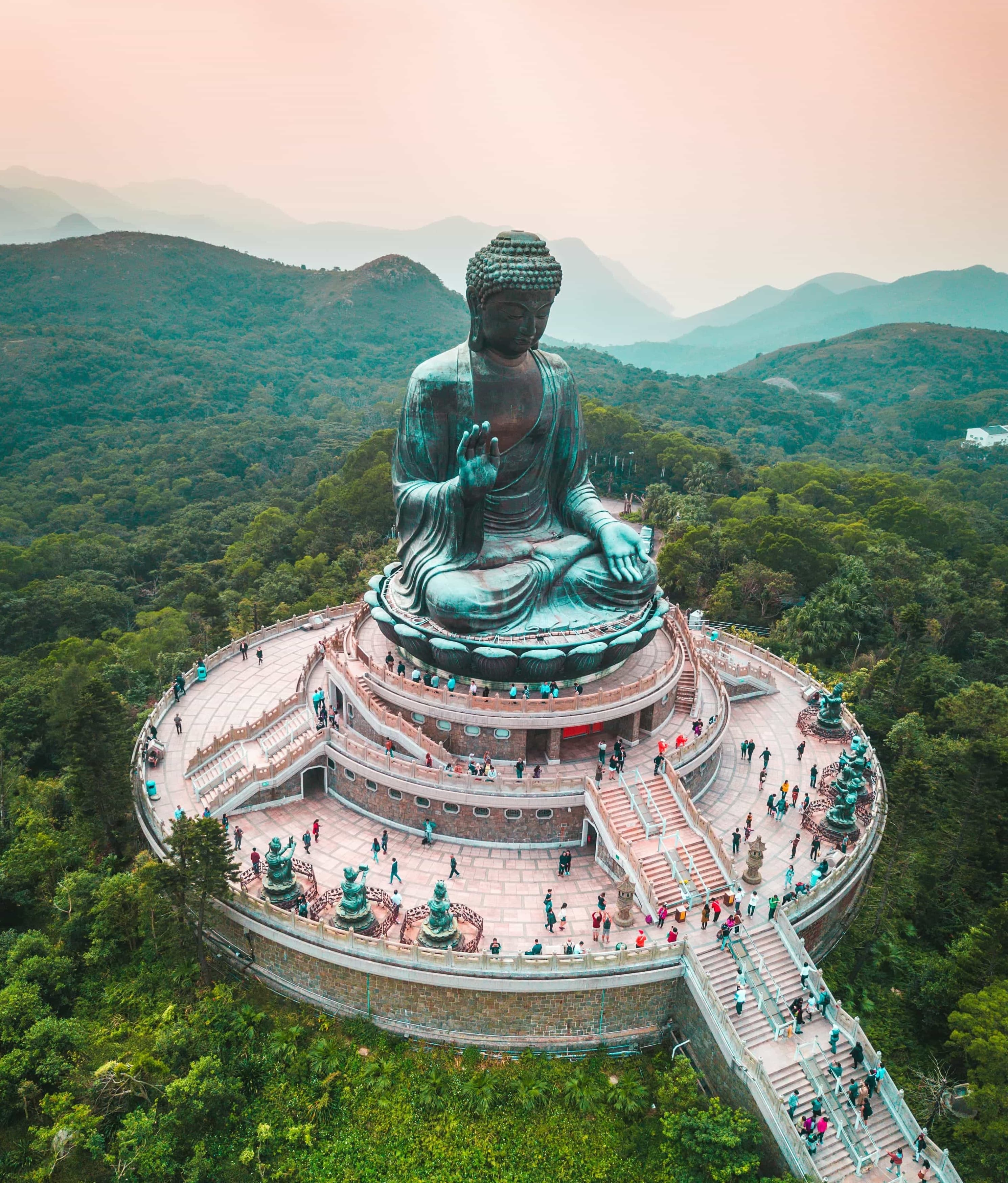 Tian Tan Buddha (天坛大佛) - A majestic 34-meter tall bronze Buddha statue on Lantau Island, accessible via the scenic Ngong Ping...